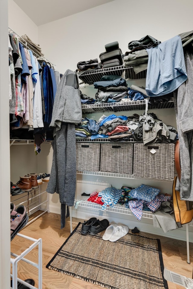 spacious closet featuring hardwood / wood-style flooring