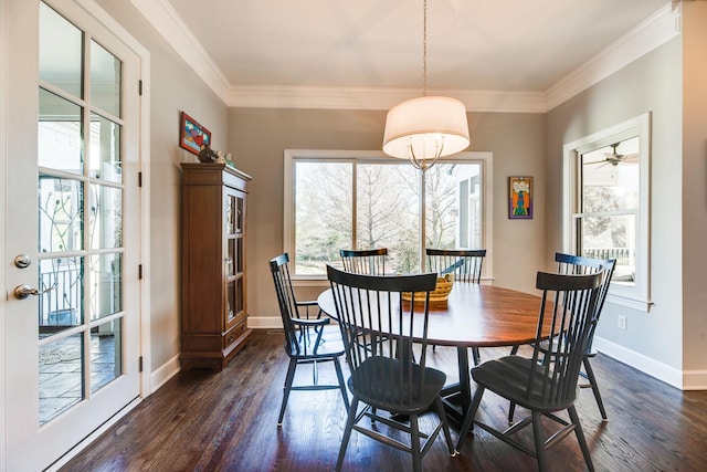 dining space featuring ceiling fan, ornamental molding, and dark hardwood / wood-style flooring