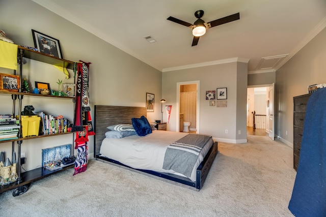 carpeted bedroom with ceiling fan, ensuite bathroom, and ornamental molding