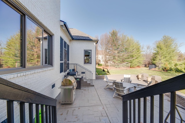 view of patio featuring a grill