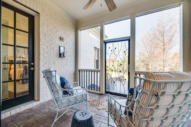 sunroom / solarium with ceiling fan