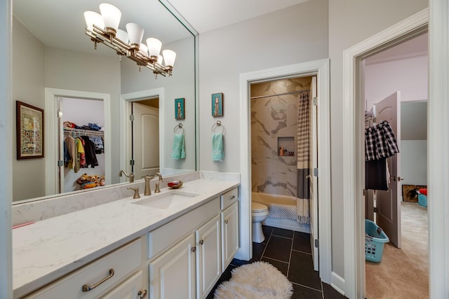 bathroom with tile patterned flooring, toilet, walk in shower, and vanity