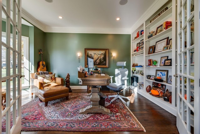 sitting room with french doors, built in features, crown molding, and wood-type flooring