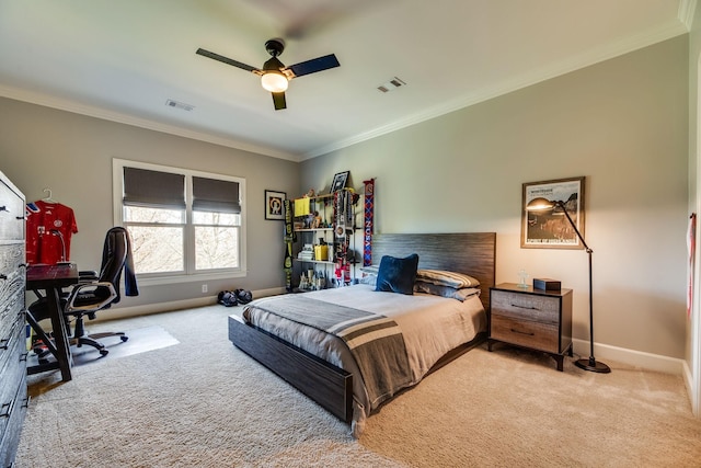 carpeted bedroom featuring ceiling fan and crown molding