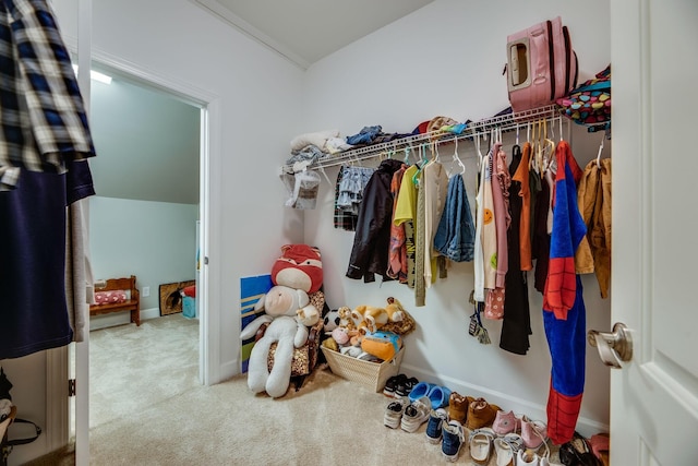 walk in closet featuring carpet