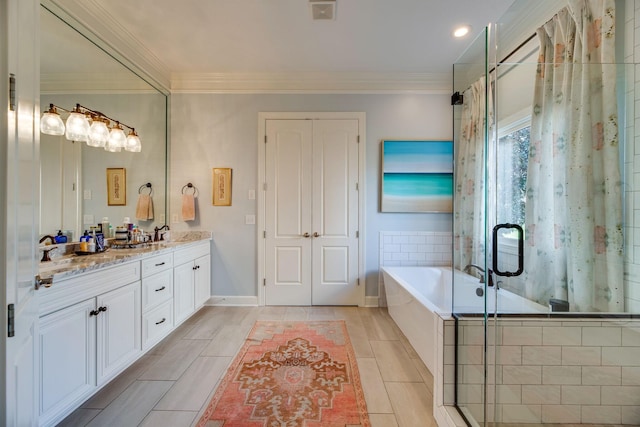 bathroom with vanity, ornamental molding, and plus walk in shower