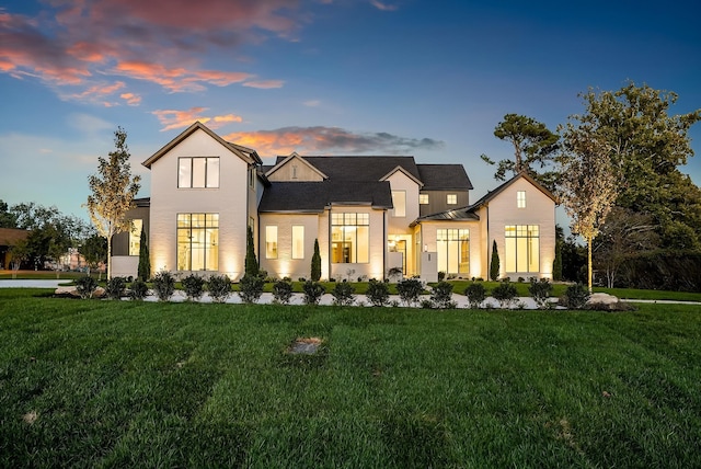 view of front of property with a lawn