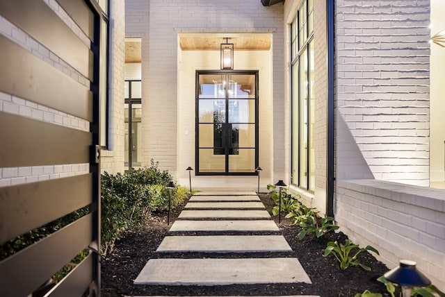 view of exterior entry featuring french doors