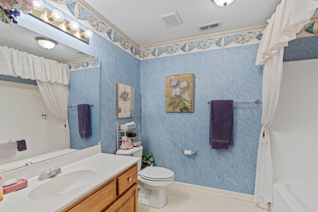 full bathroom featuring a textured ceiling, toilet, vanity, and shower / bath combination with curtain