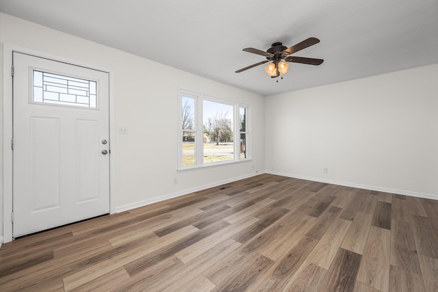 entryway with ceiling fan and hardwood / wood-style flooring