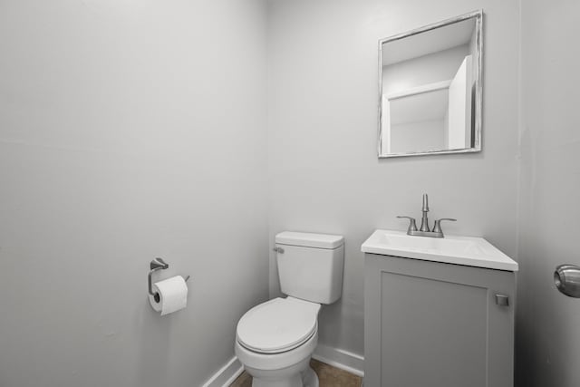 bathroom with toilet and vanity