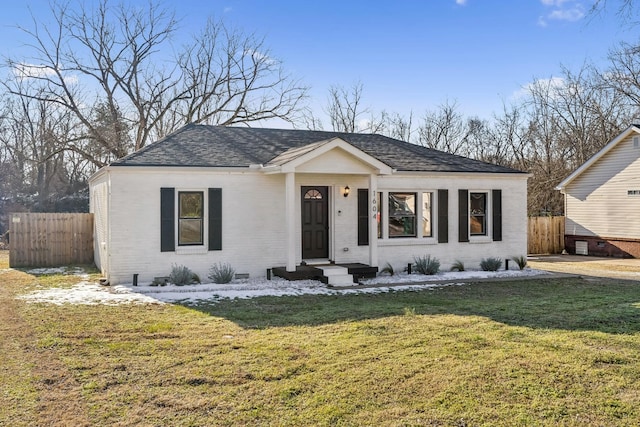 single story home with a front yard