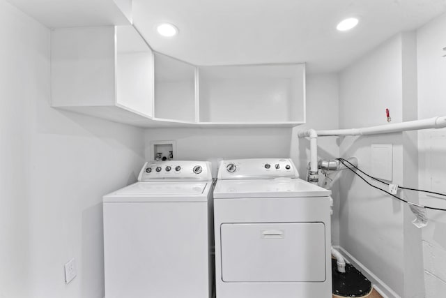 washroom featuring recessed lighting, laundry area, and separate washer and dryer