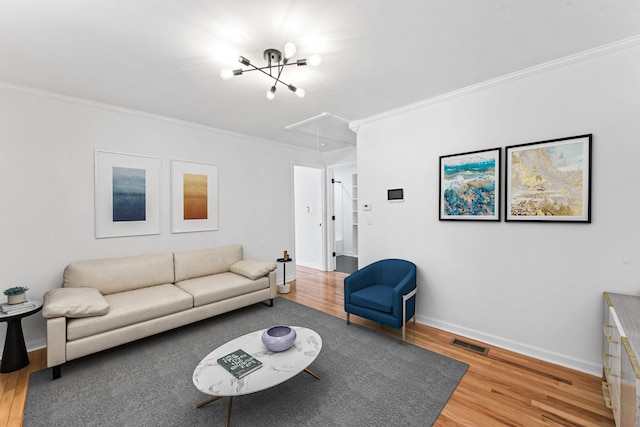 living room featuring hardwood / wood-style flooring and ornamental molding