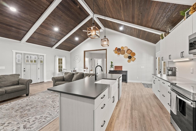 kitchen featuring hanging light fixtures, wooden ceiling, white cabinetry, and stainless steel appliances