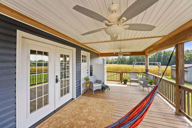 deck with ceiling fan and french doors