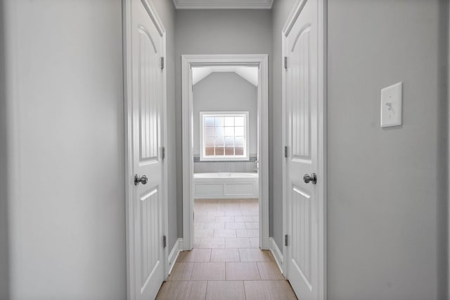 hall featuring vaulted ceiling