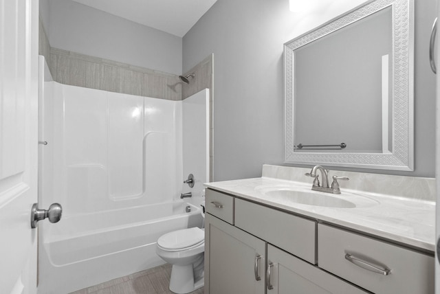 full bathroom with toilet,  shower combination, and vanity