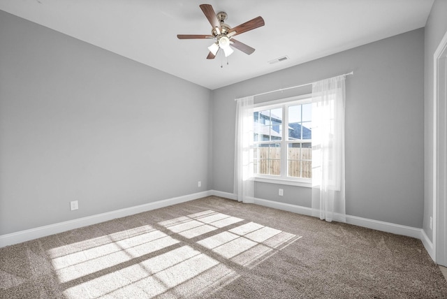 carpeted empty room with ceiling fan