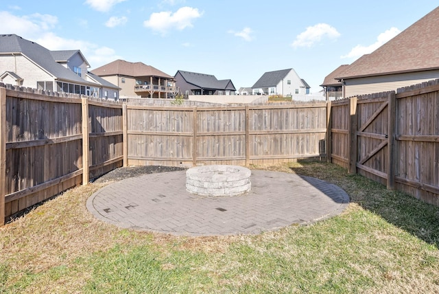 view of yard with an outdoor fire pit and a patio