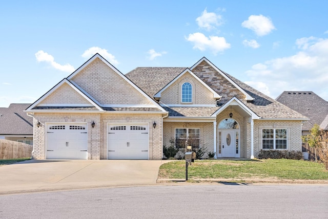 view of front facade featuring a front yard and a garage