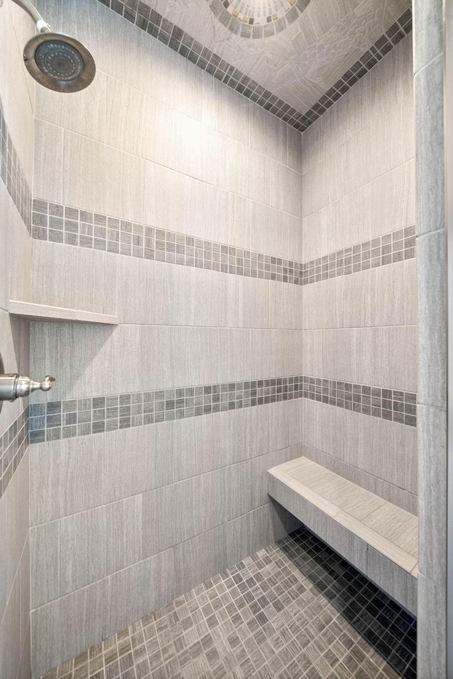 bathroom with tiled shower