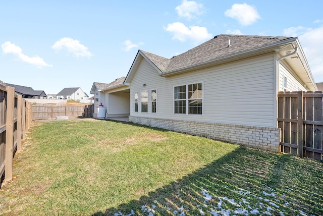 back of property featuring a yard