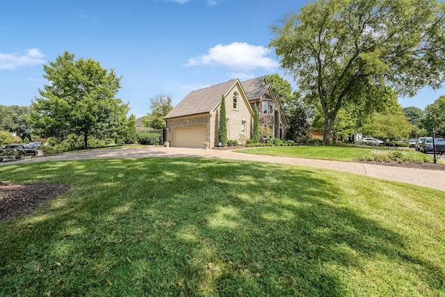 view of side of property featuring a garage and a lawn