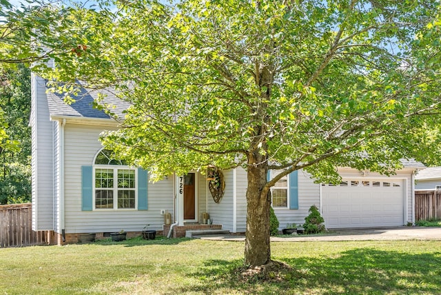 obstructed view of property featuring a garage and a front lawn