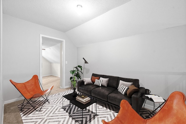 living room featuring light carpet, a textured ceiling, and lofted ceiling