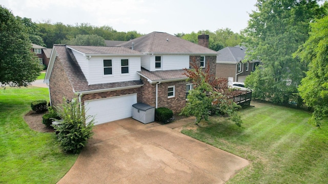 view of front of house with a garage and a front lawn