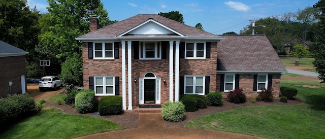 view of front of home with a front yard