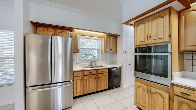 kitchen with light tile patterned flooring, sink, appliances with stainless steel finishes, and tasteful backsplash