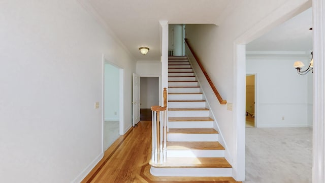 stairway featuring ornamental molding