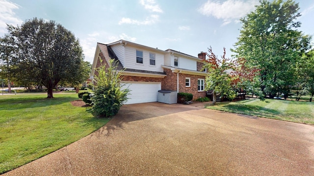 view of front property featuring a garage and a front lawn