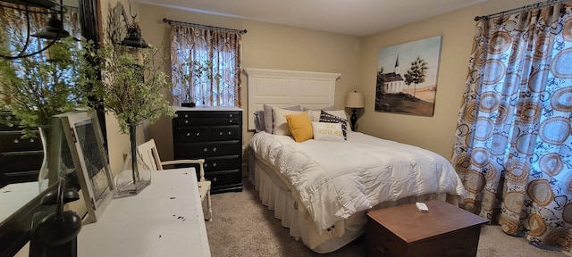 bedroom featuring light colored carpet