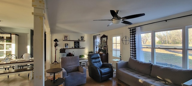 living room featuring ceiling fan and hardwood / wood-style floors