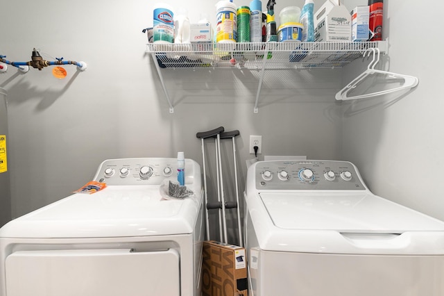 laundry room featuring separate washer and dryer