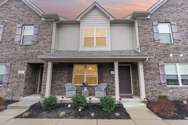 multi unit property featuring a porch