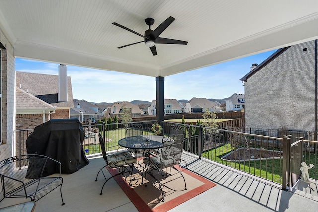 view of patio with a ceiling fan, a residential view, outdoor dining area, and a grill