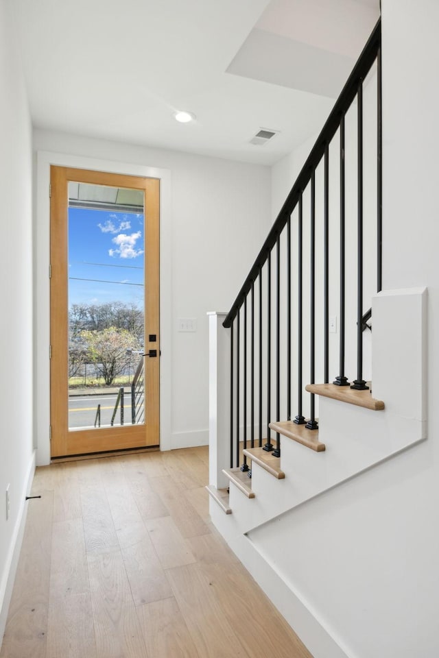 foyer entrance featuring light wood-type flooring