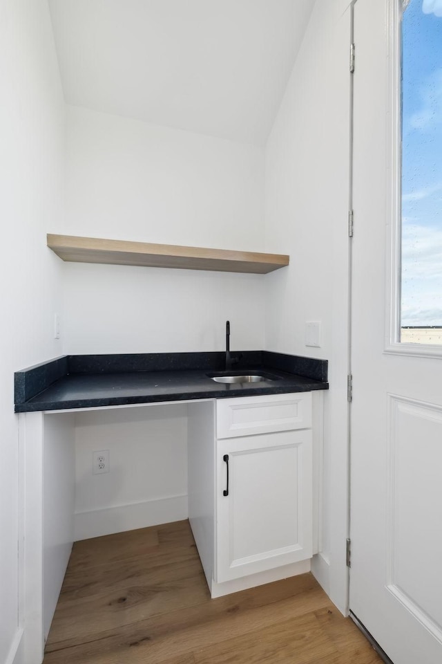 interior space with sink and light wood-type flooring