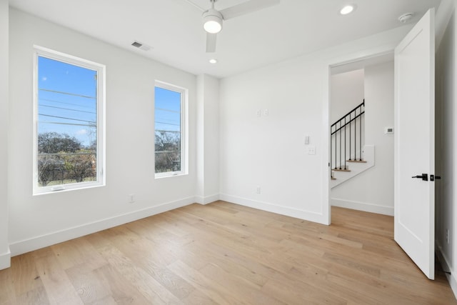 unfurnished room featuring ceiling fan and light hardwood / wood-style flooring