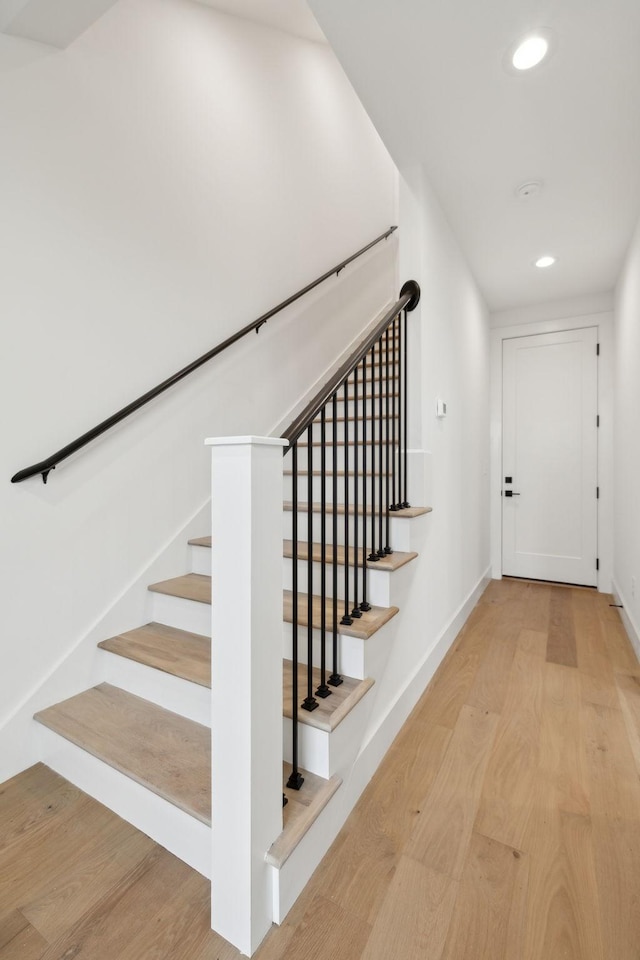 stairway featuring hardwood / wood-style floors