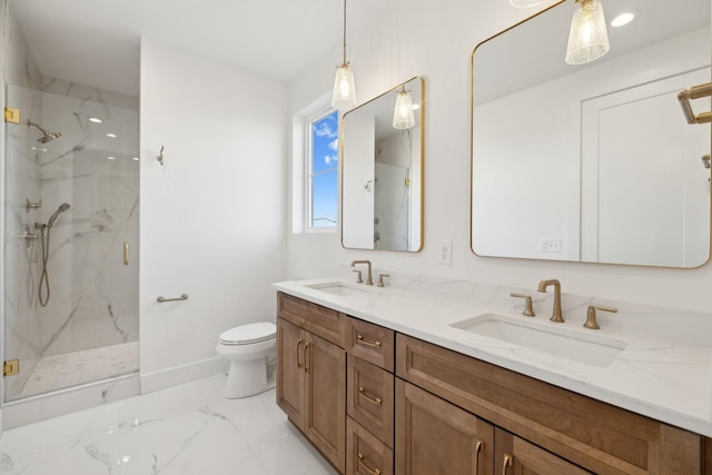 bathroom featuring vanity, toilet, and a shower with door