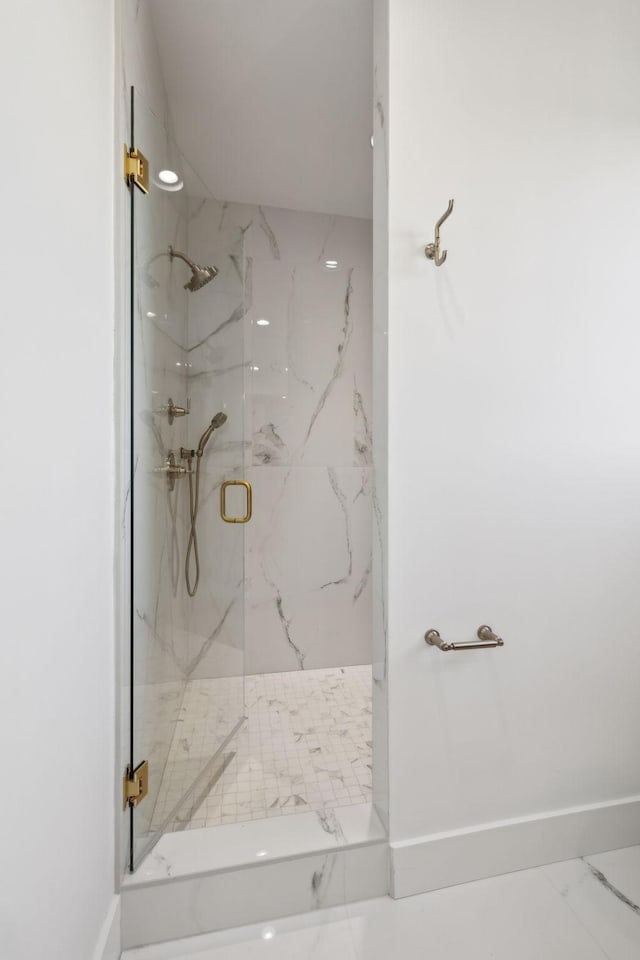 bathroom with a shower with shower door