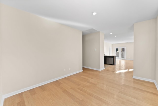 unfurnished room with light hardwood / wood-style flooring