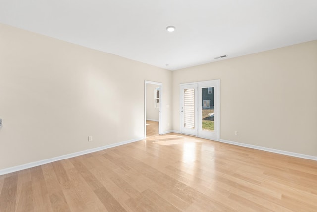 unfurnished room featuring light hardwood / wood-style flooring