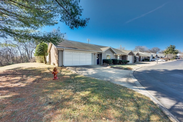 single story home featuring a garage and a front lawn