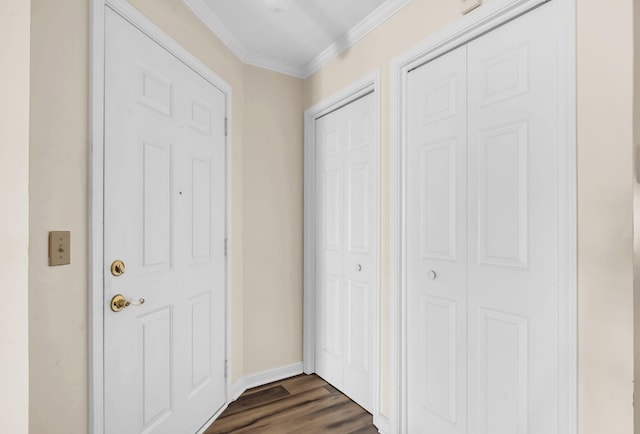 doorway to outside with dark hardwood / wood-style floors and ornamental molding